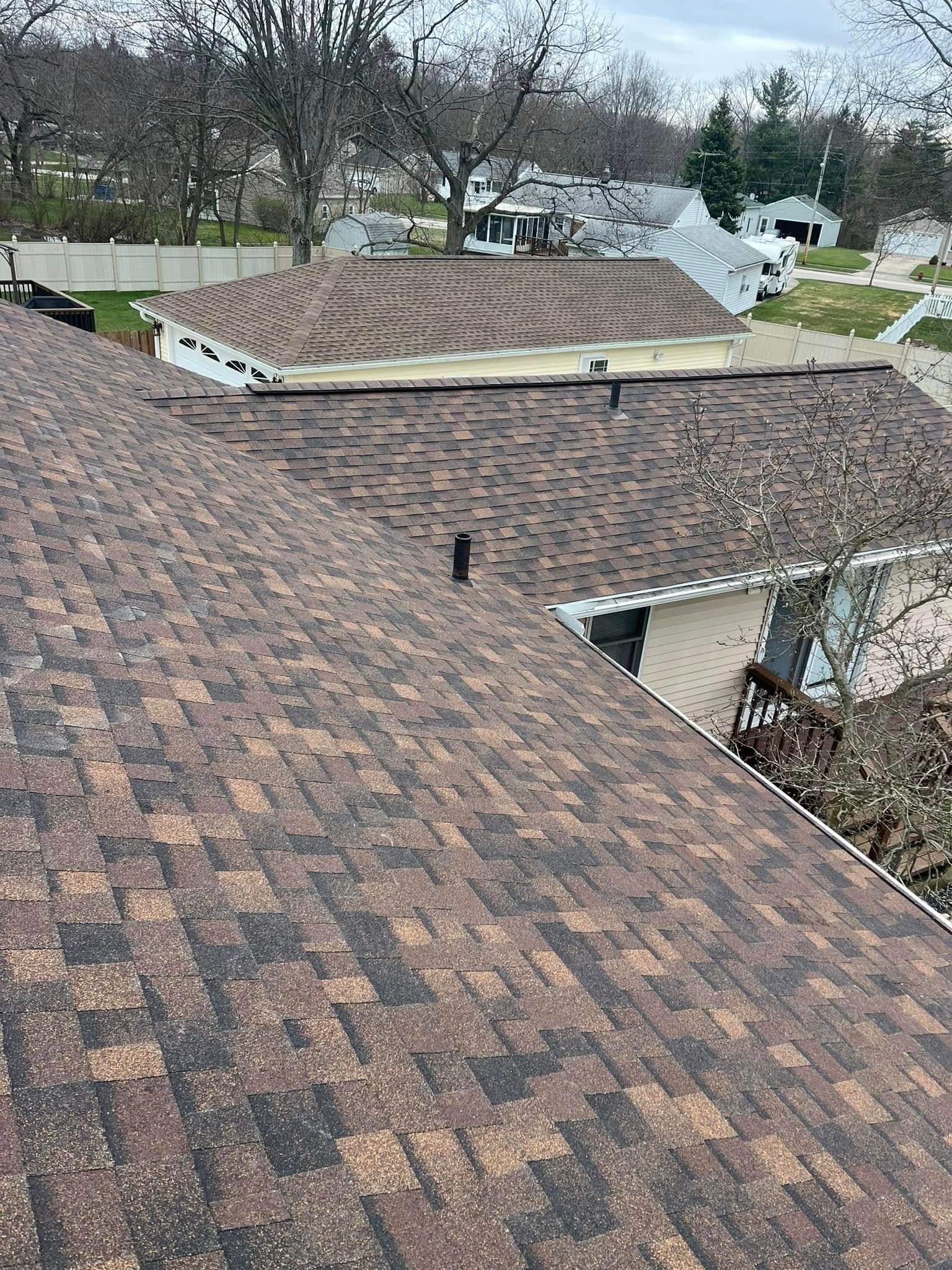 A close up of a roof with a lot of shingles on it.