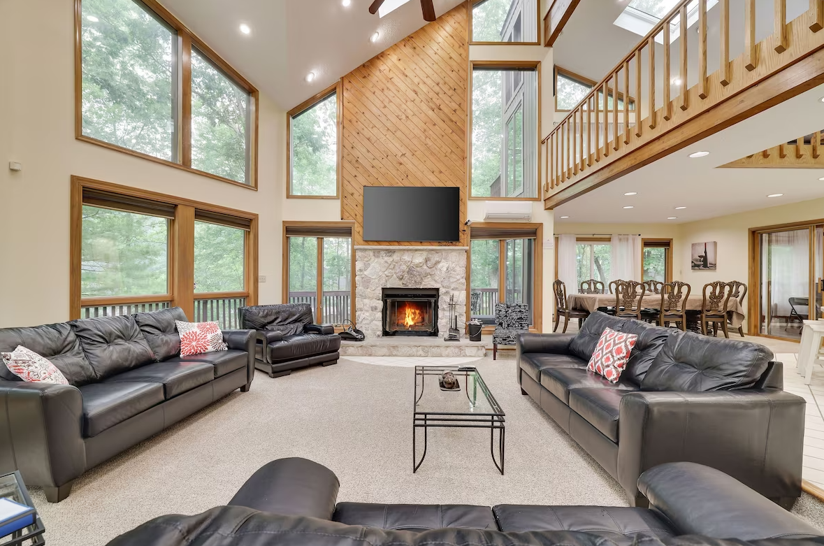 A living room filled with furniture and a fireplace.