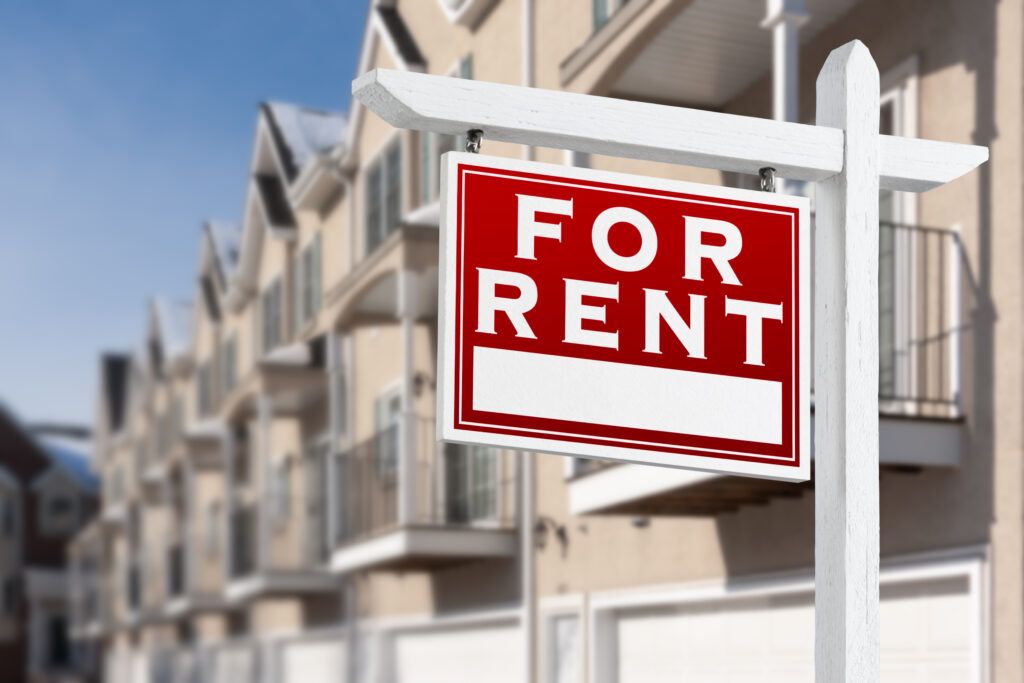 For Rent Sign in Front of Townhomes