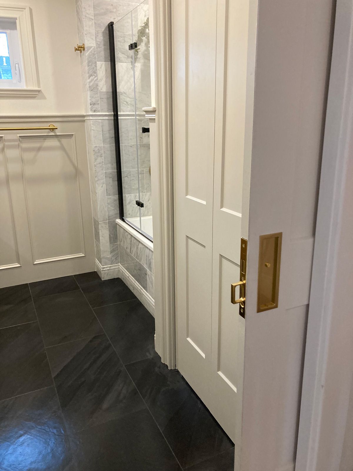 door to bathroom and bath tub