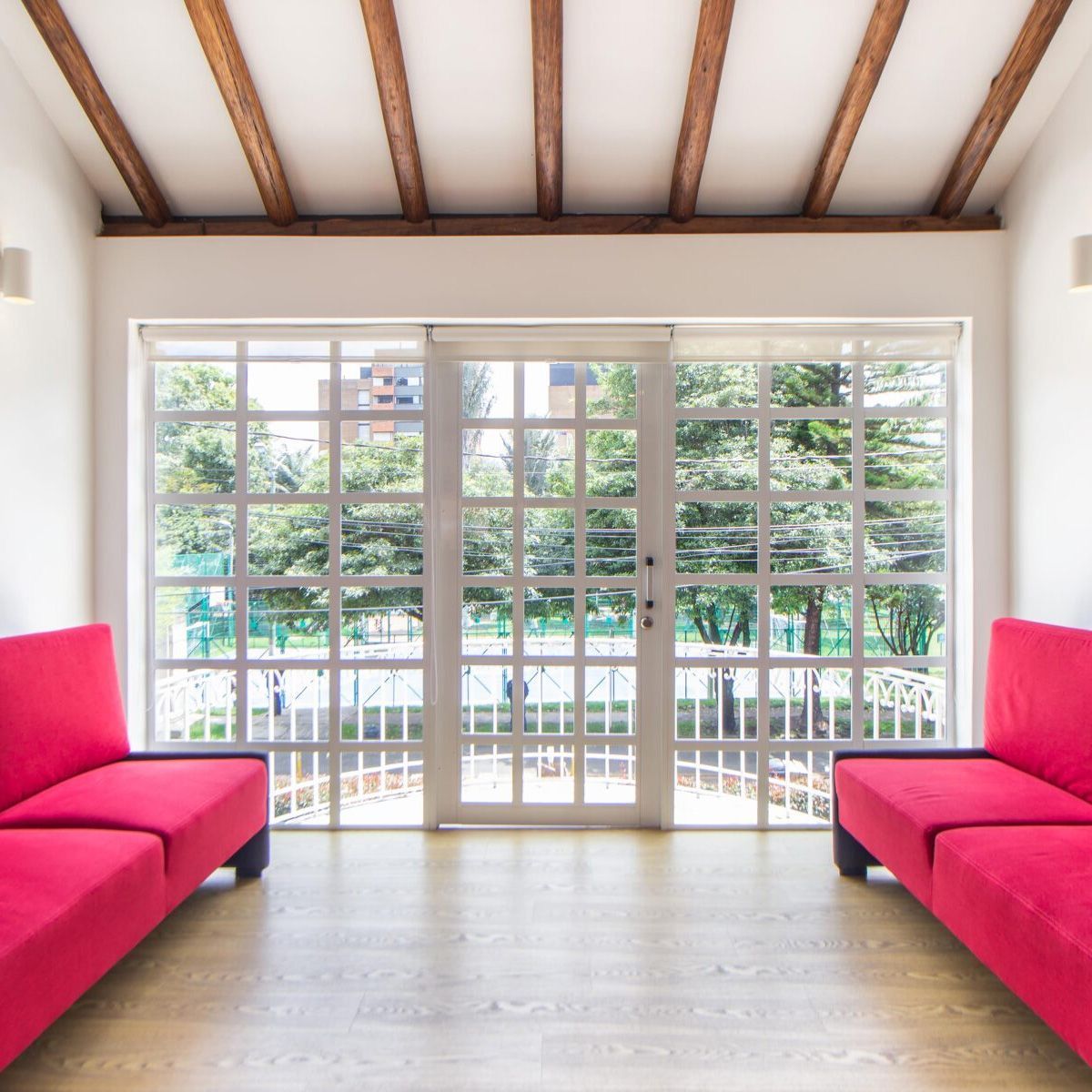 room with windows and two couches