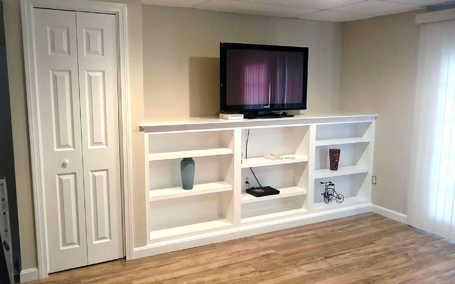 white shelf under a tv