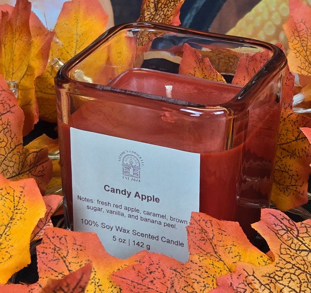 Candy Apple scented 100% soy candle in a 5 ounce glass cube jar.