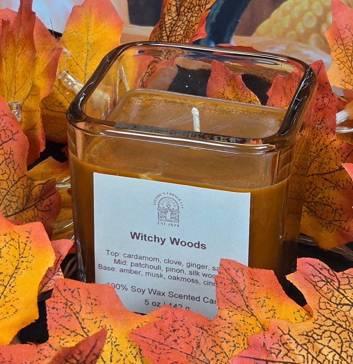 Witchy Woods scented 100% soy candle in a 5 ounce glass cube jar.