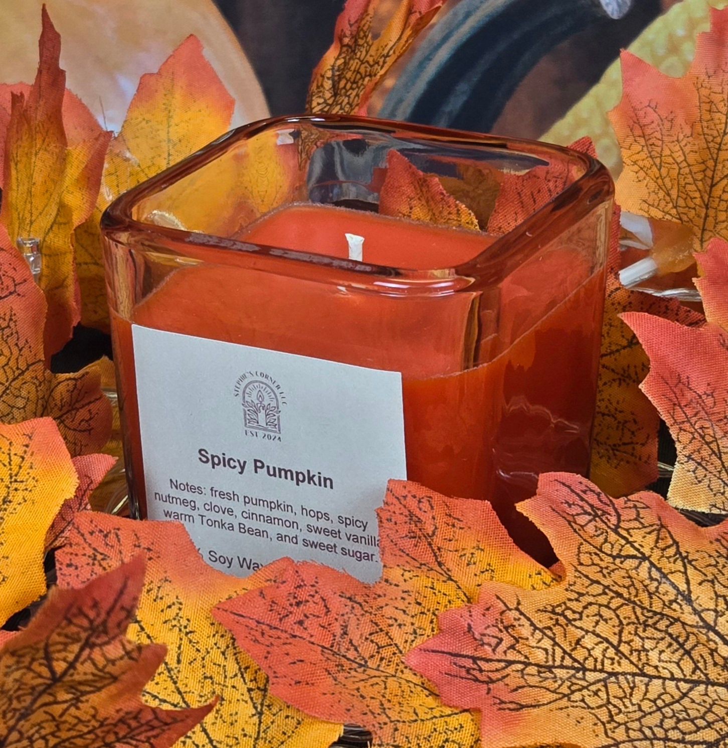 Spicy Pumpkin scented 100% soy candle in a 5 ounce glass cube jar.