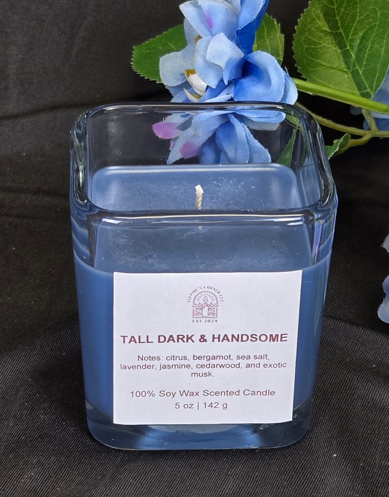 Tall Dark & Handsome scented 100% soy candle in a 5 ounce glass cube jar.