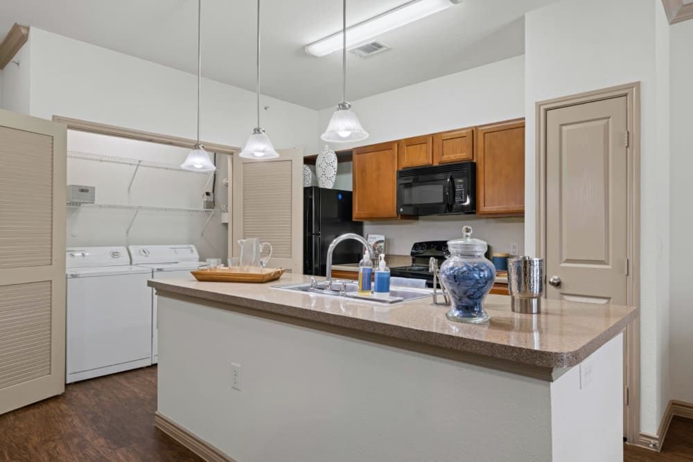 Modern Kitchen with Spacious Island at The Marquis at Brushy Creek