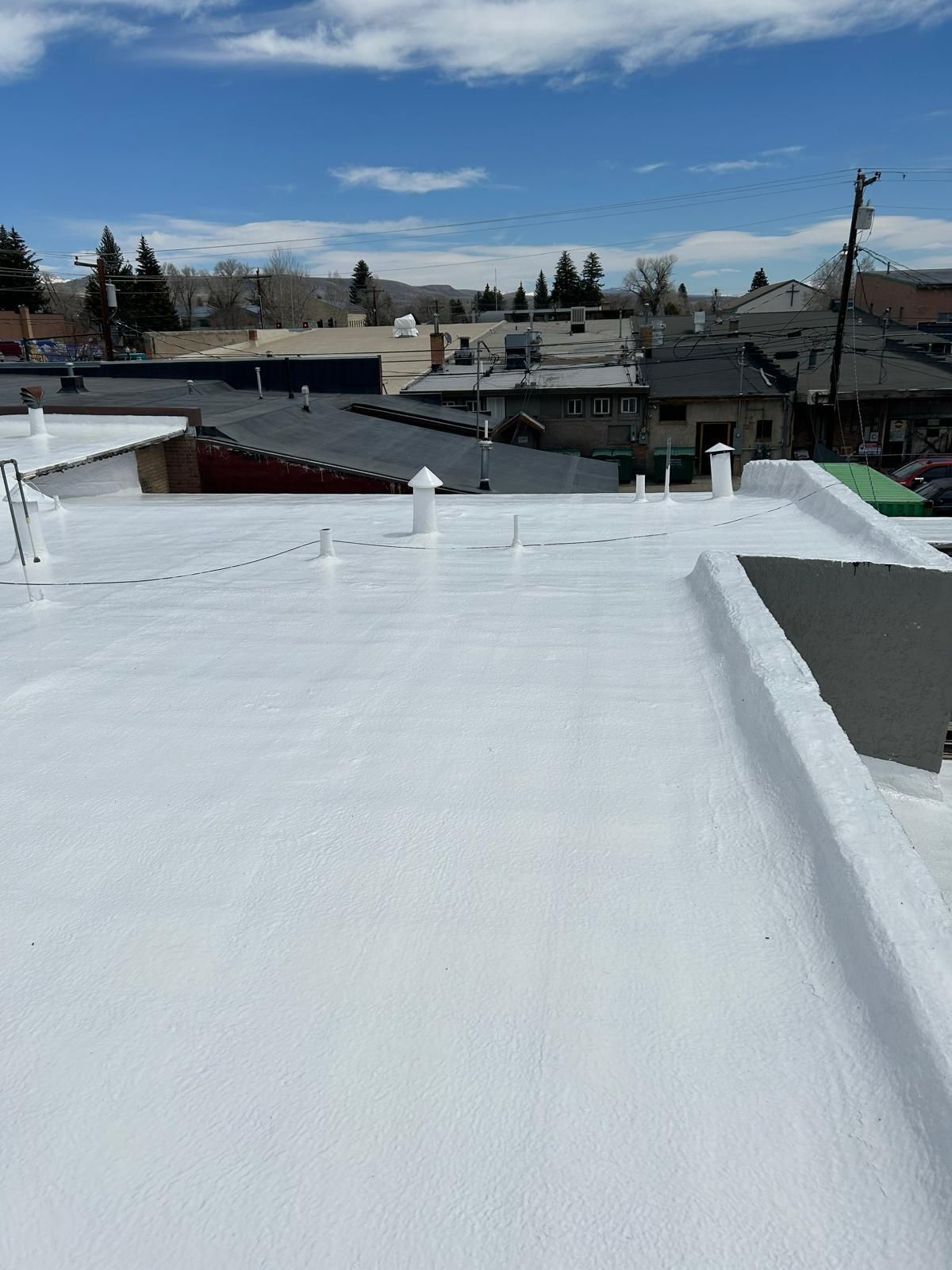 A white roof with a blue sky in the background