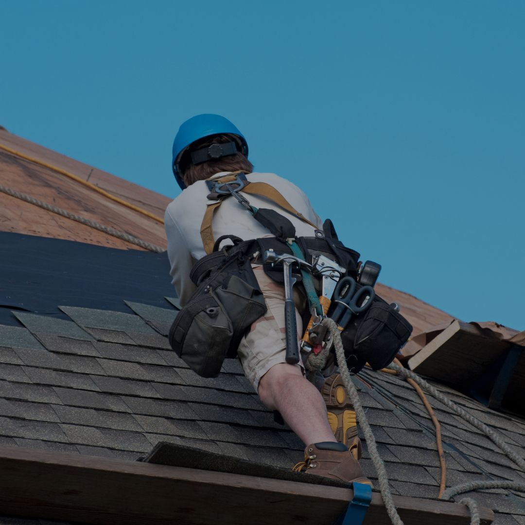 Colorado Owned Roofing company. Man working on roof.