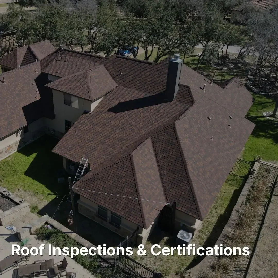 Aerial view of a residential shingle roof with a ladder leaning against the side, labeled