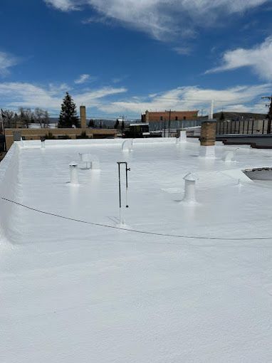 A white roof with a blue sky in the background.