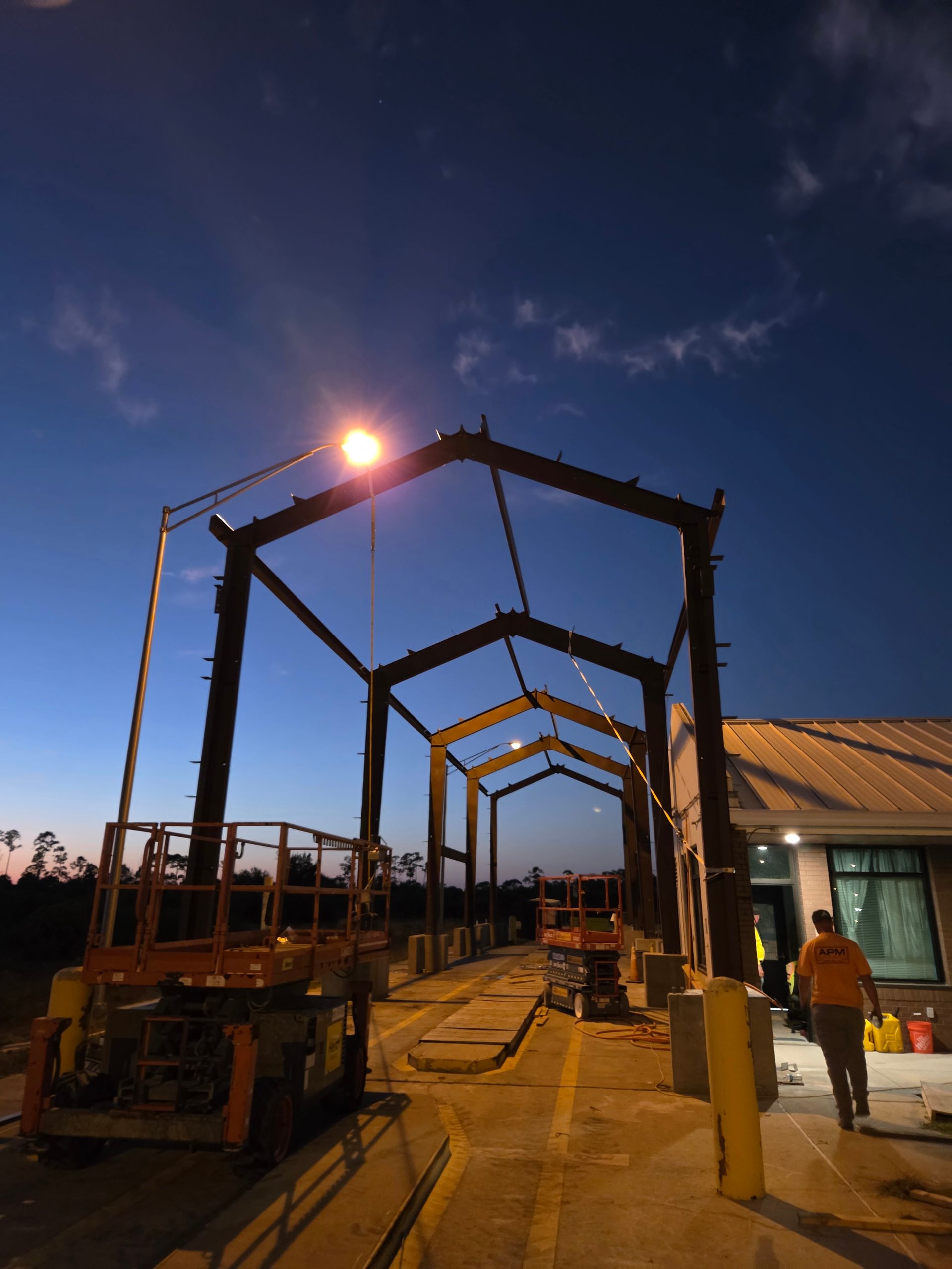 View of a metal roof structure, angled lines with a support beam.