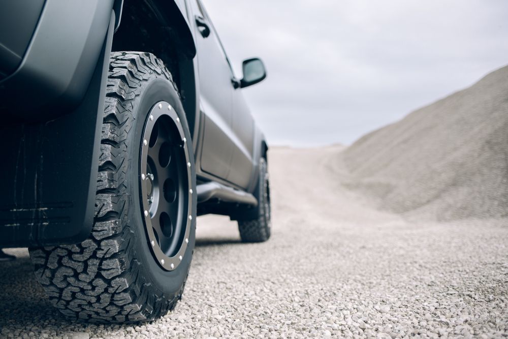 A Black Truck Is Parked On A Gravel Road — Maitland 4WD Centre In Singleton, NSW