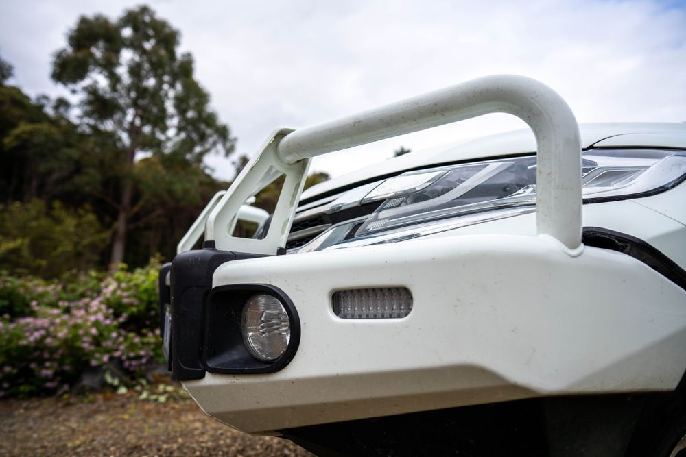 A Close Up Of The Front Bumper Of A White Truck — Maitland 4WD Centre In Lake Macquarie, NSW