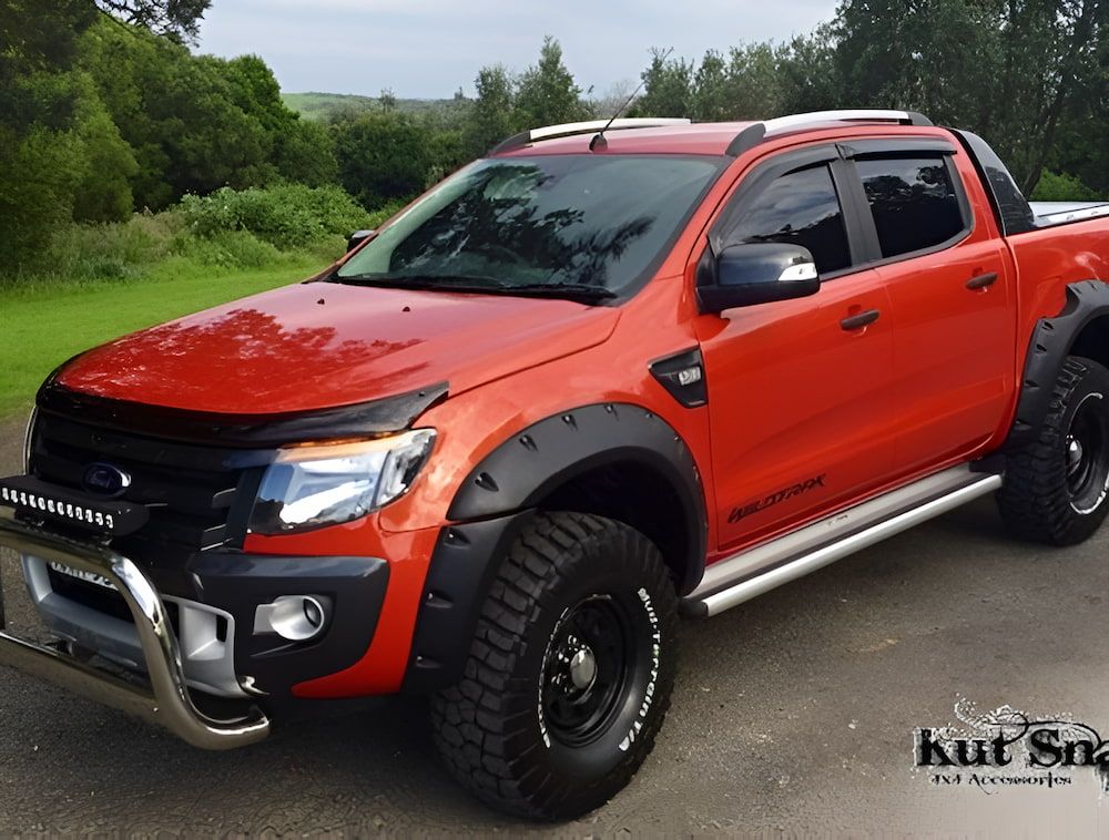 A Red Ford Truck Is Parked On The Side Of The Road — Maitland 4WD Centre In Maitland, NSW