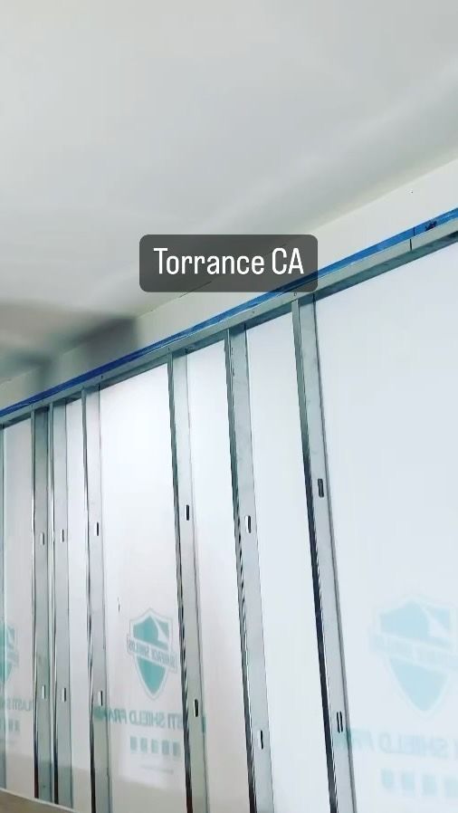 A wall with a sign that says torrance ga on it.