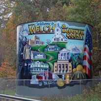A mural on the side of a truck says welcome to welch and mcdowell county.
