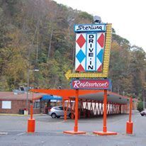 A drive-in restaurant with a sign that says `` sterling drive-in restaurant ''.