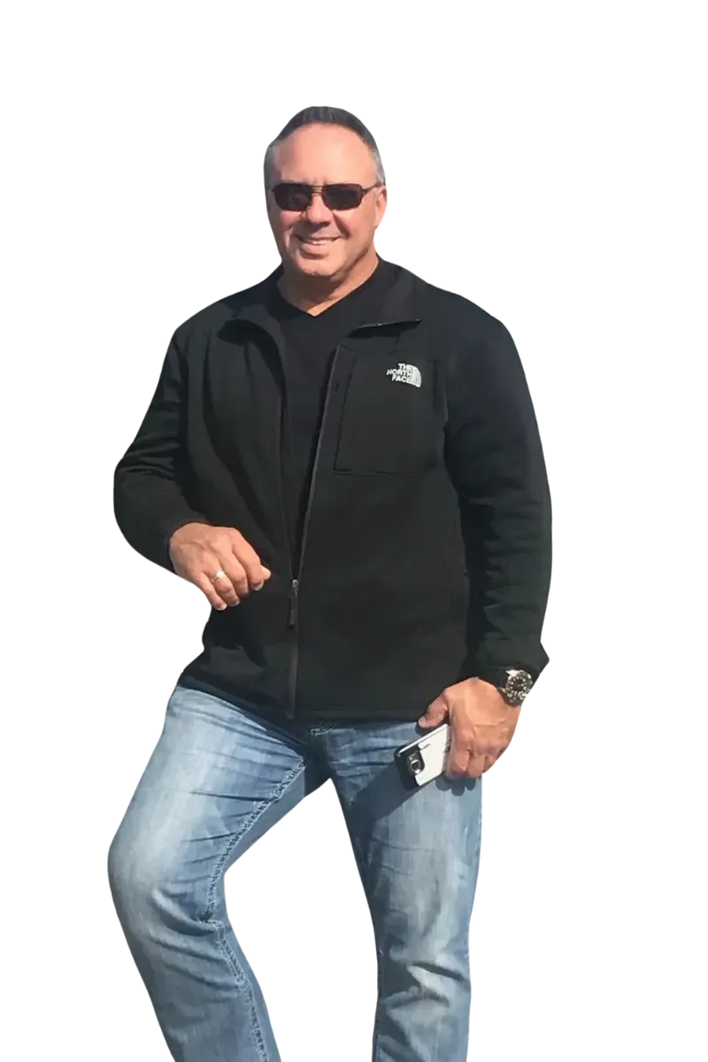 A man wearing sunglasses and a black north face jacket