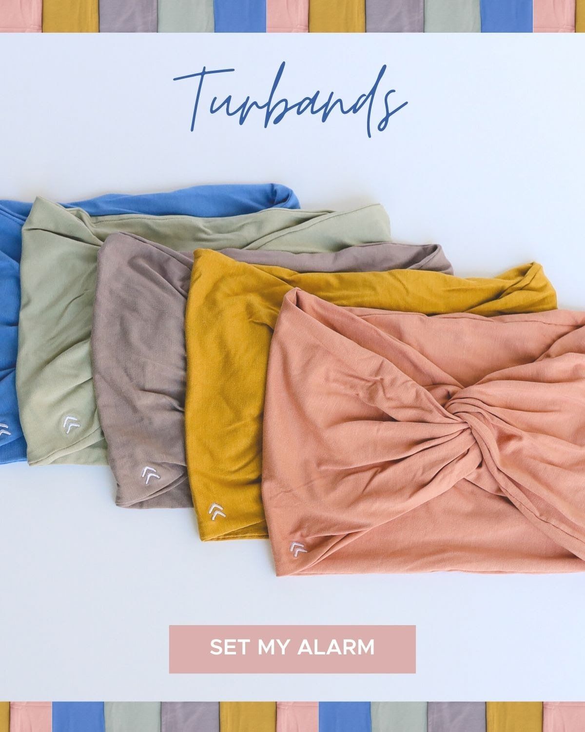 A bunch of turbans are sitting on top of each other on a table.