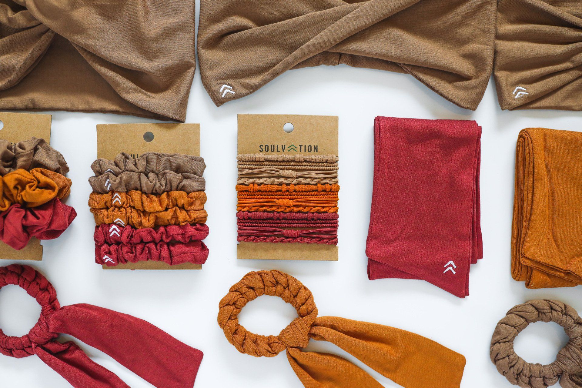 A variety of hair accessories are laid out on a table.