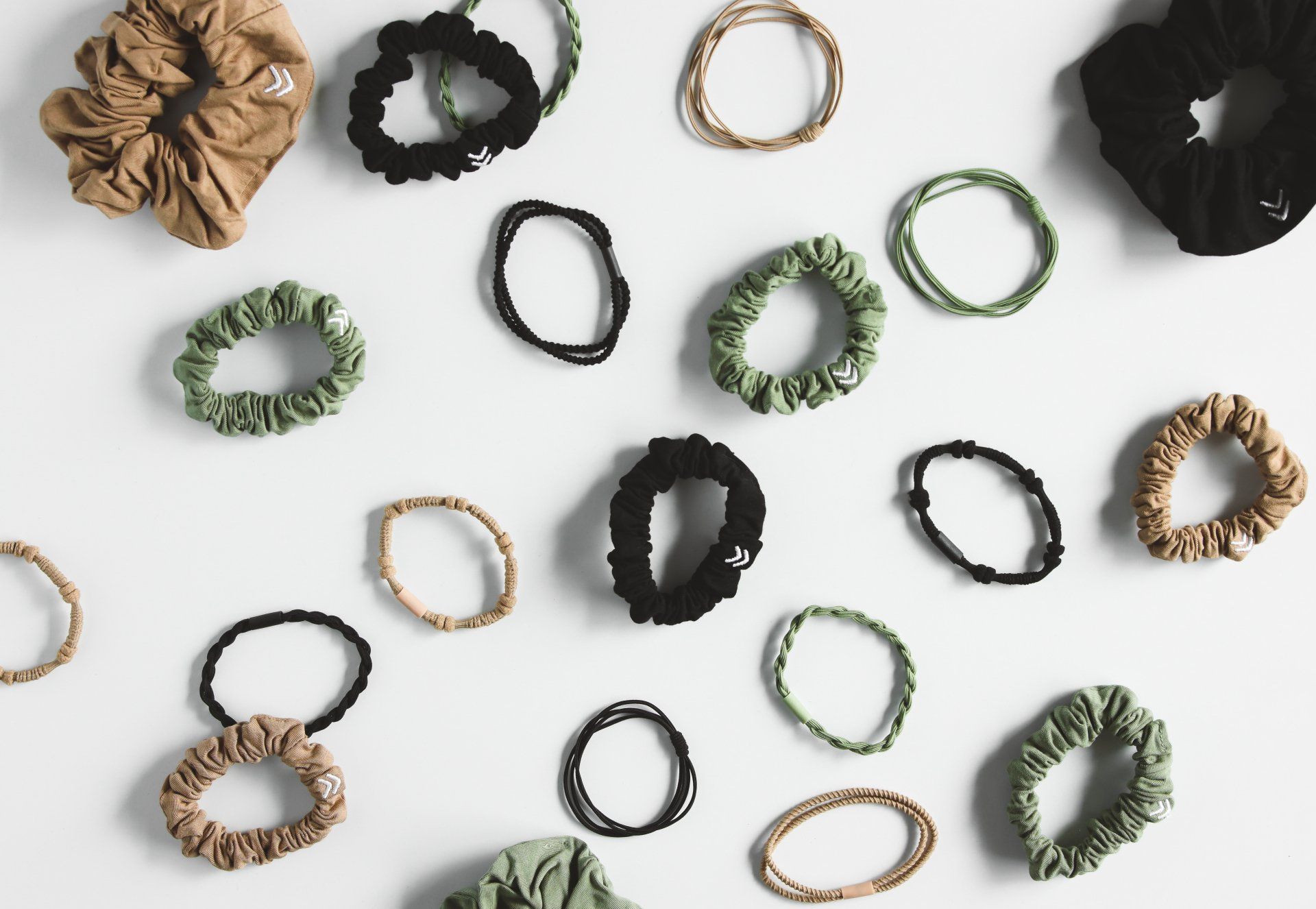 A bunch of hair ties on a white surface