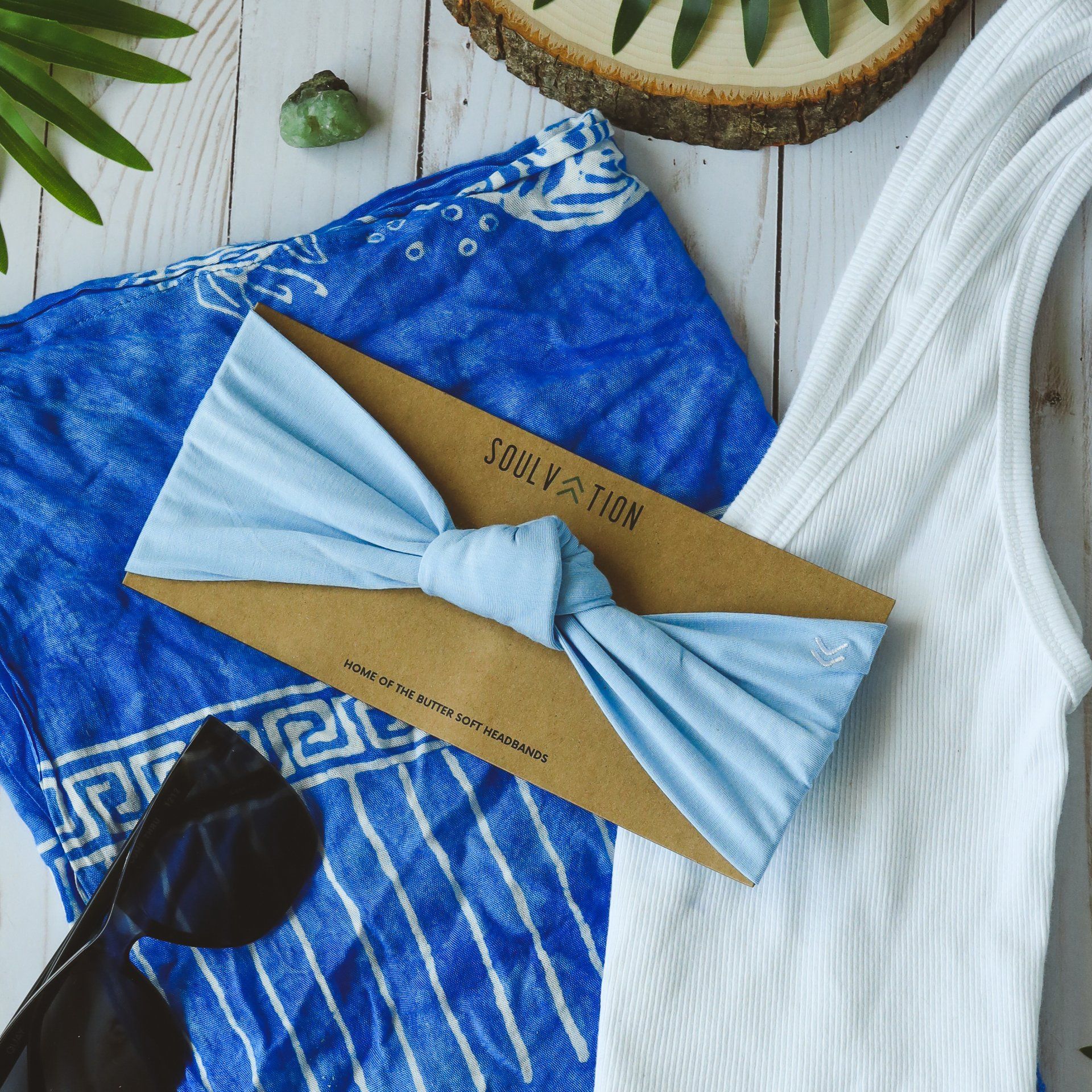 A blue headband with the word soul on it