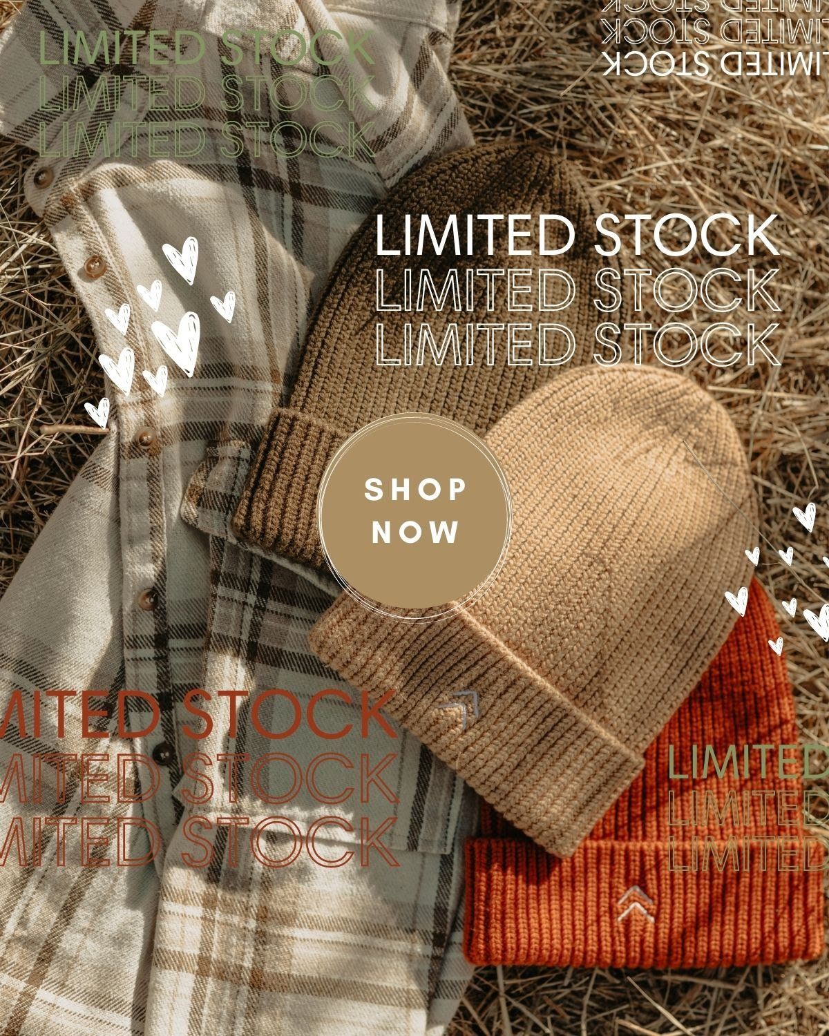 A bunch of hats are sitting on top of a pile of hay.