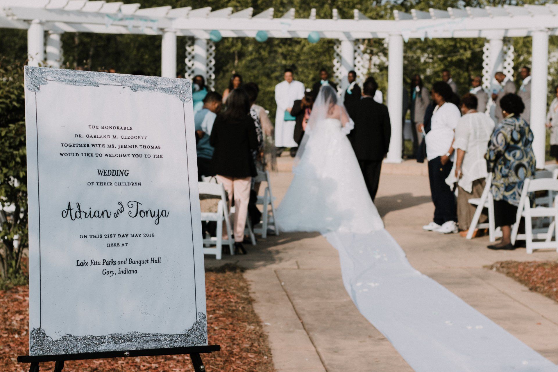 A bride and groom are walking down the aisle at a wedding ceremony.