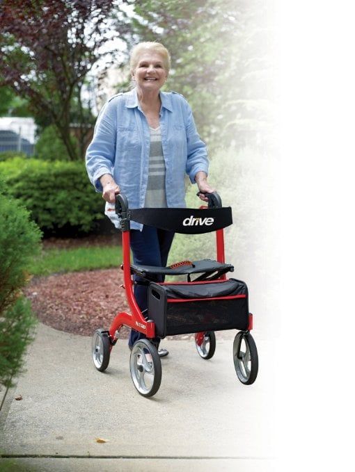 person using Nitro Folding 4 Wheeled Walker with seat