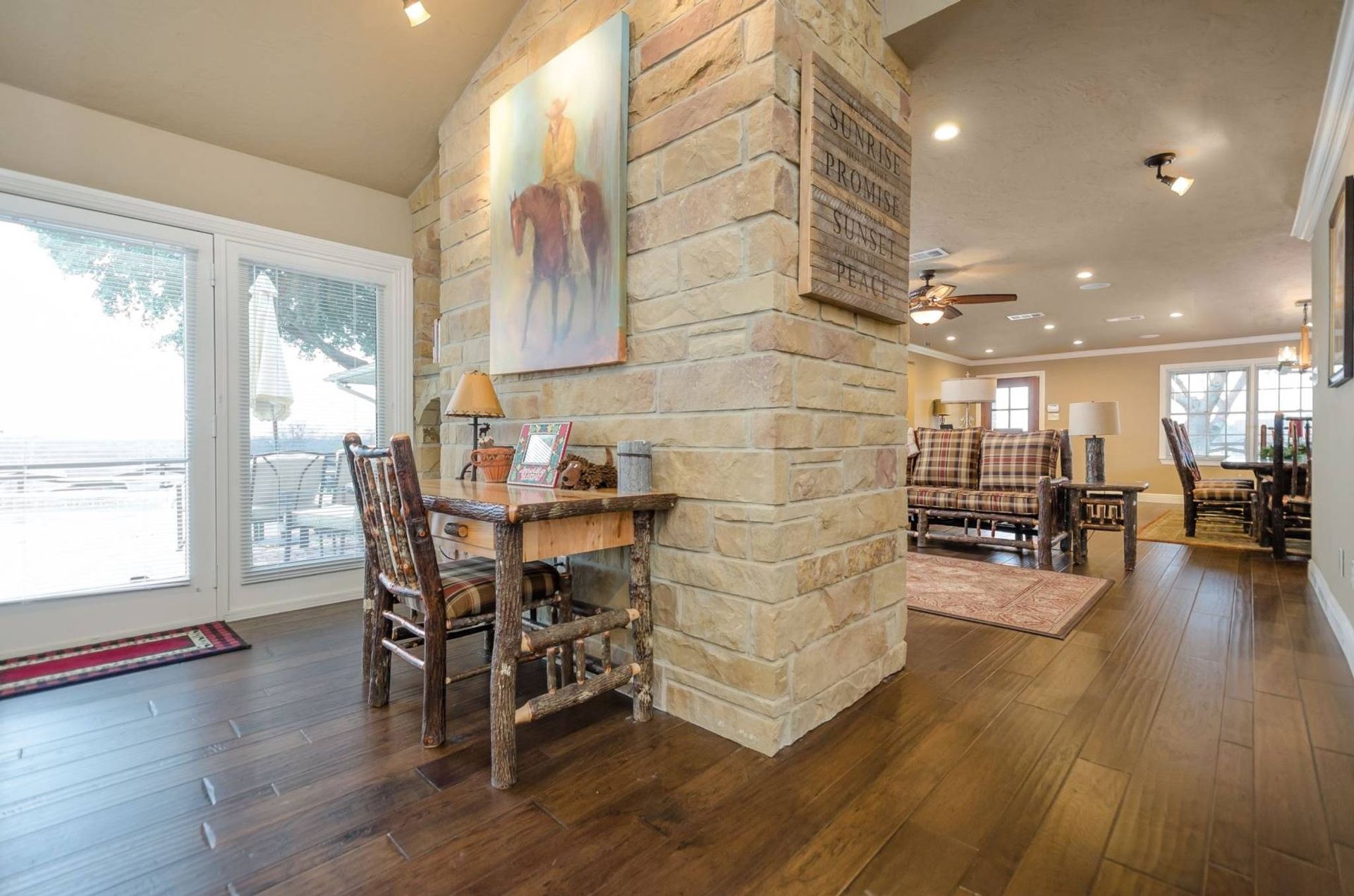 There is a table and chairs in the middle of the room.