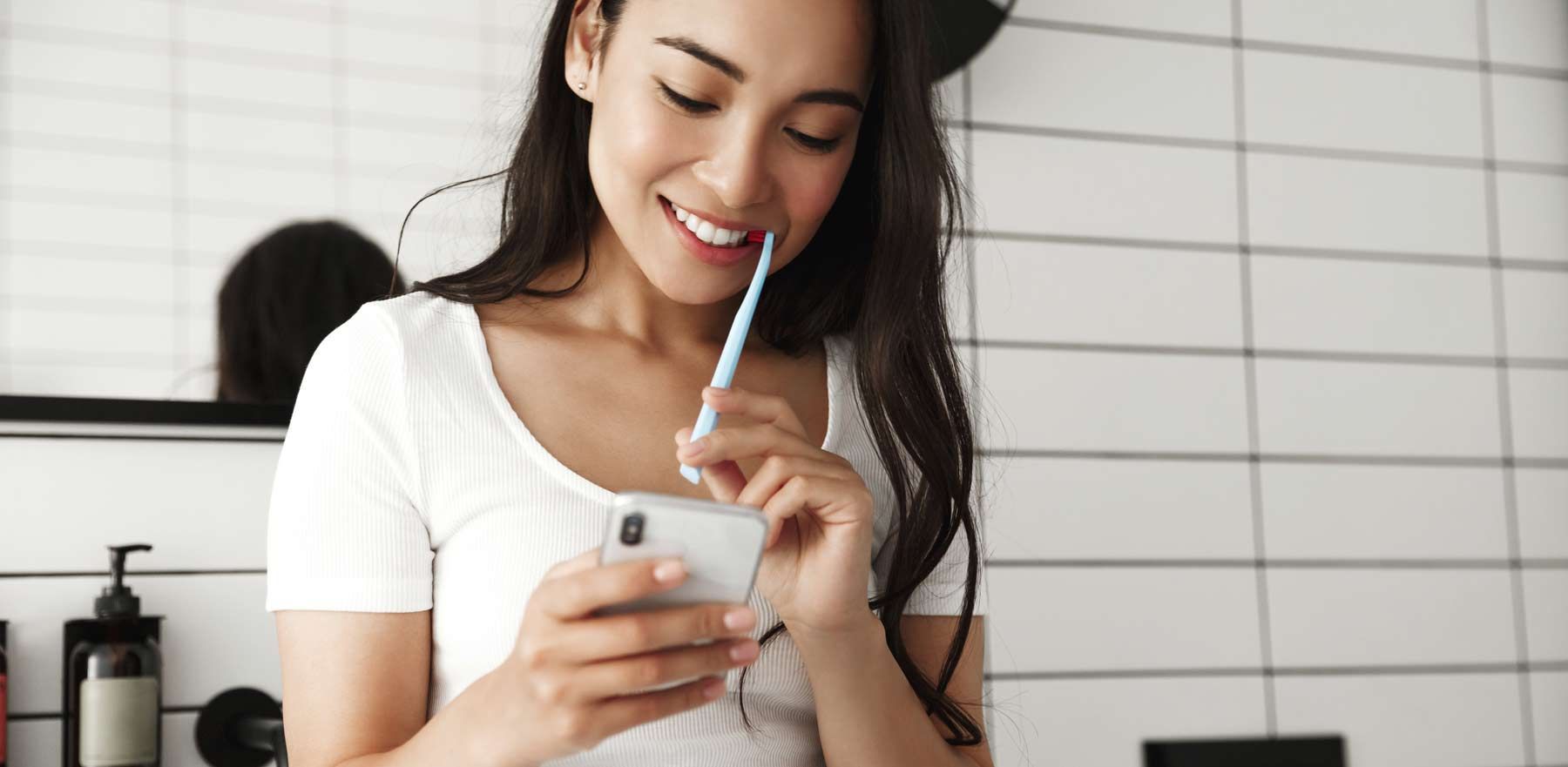 Woman looking at Mobile Apps for Dental Hygiene