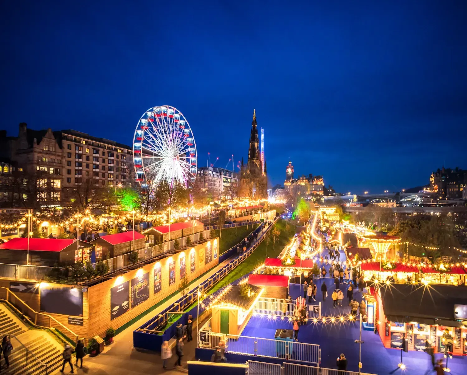 Edinburgh Christmas market with castle backdrop, cozy winter destination for fantasy winter travel