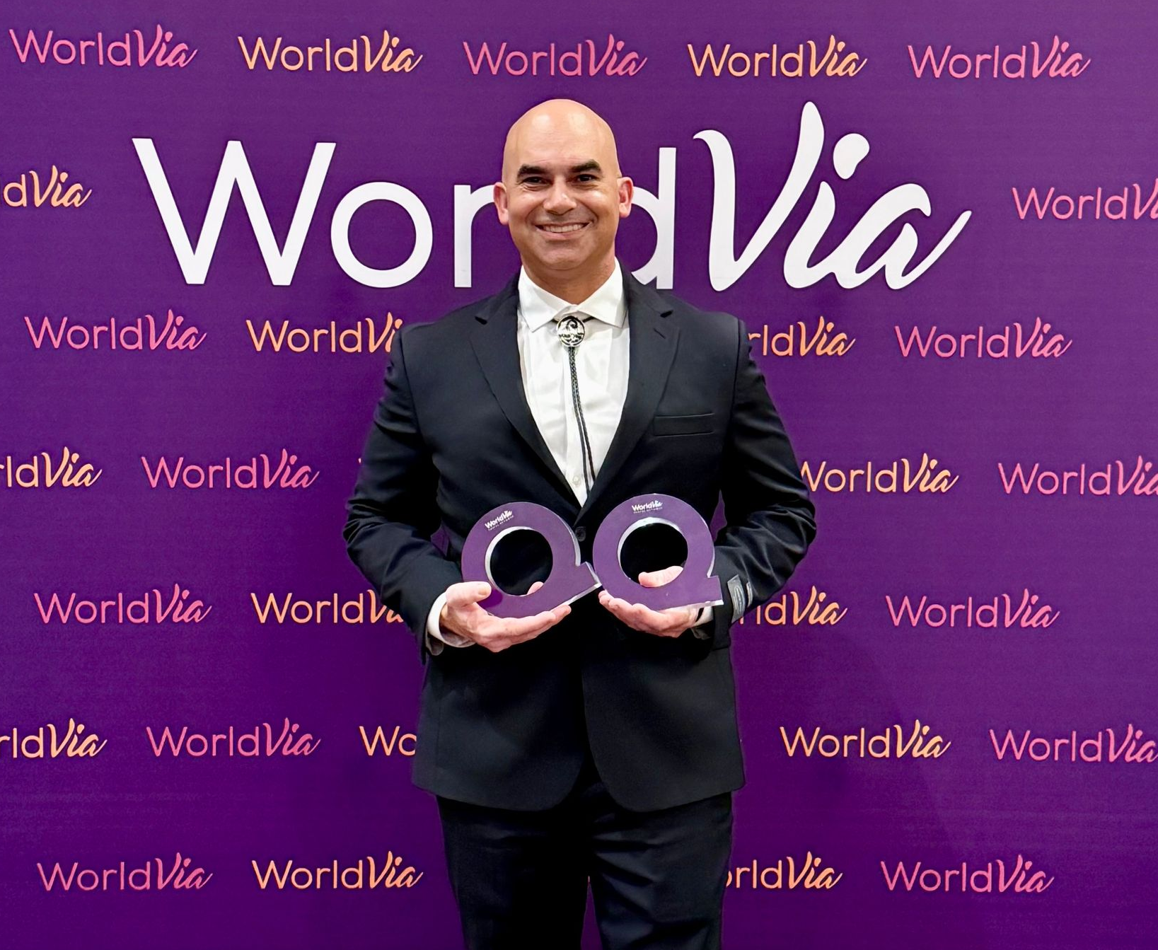 Rocky Dimico receiving two awards at WORLD25