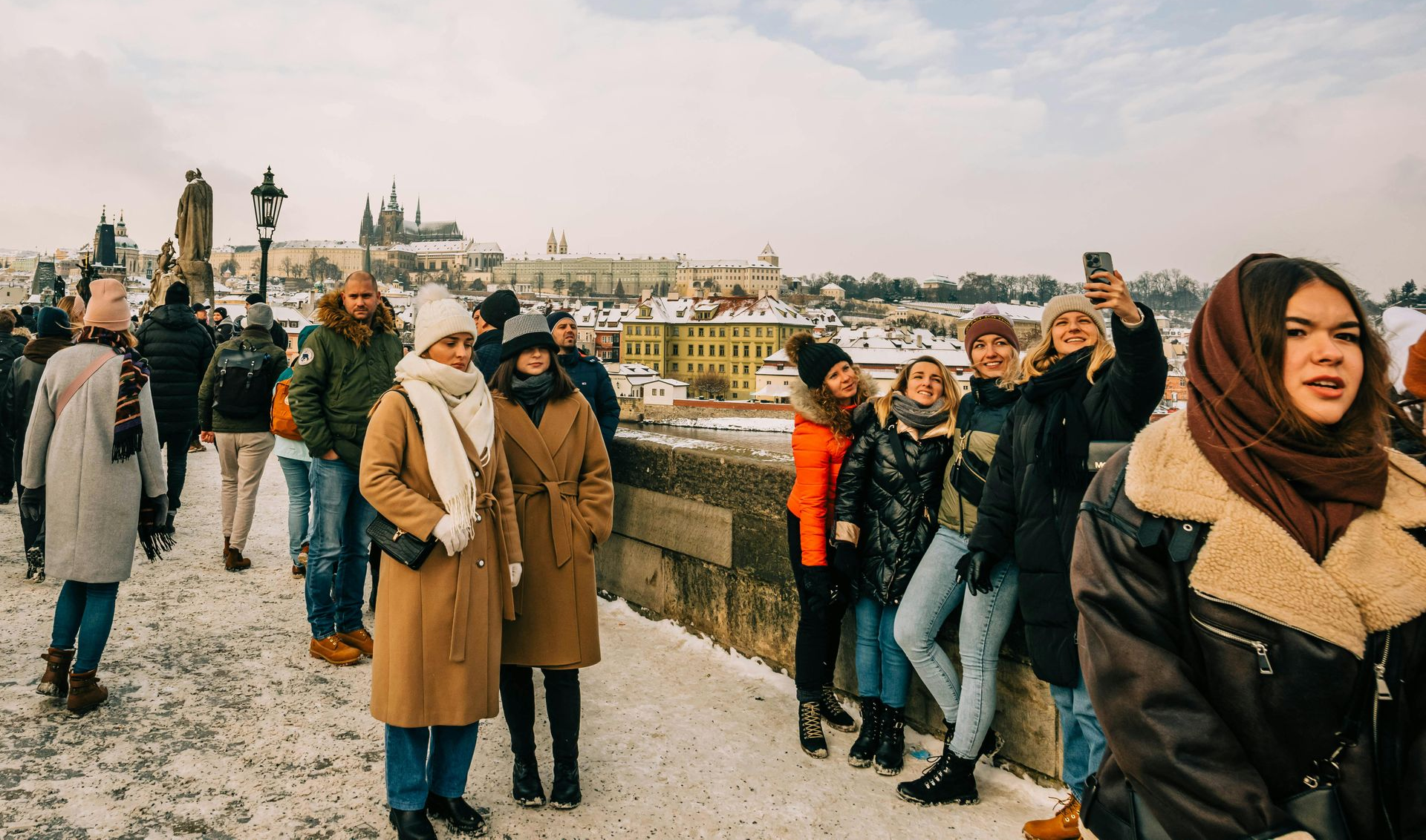 Friends celebrating a milestone trip with a magical dinner at a European castle.