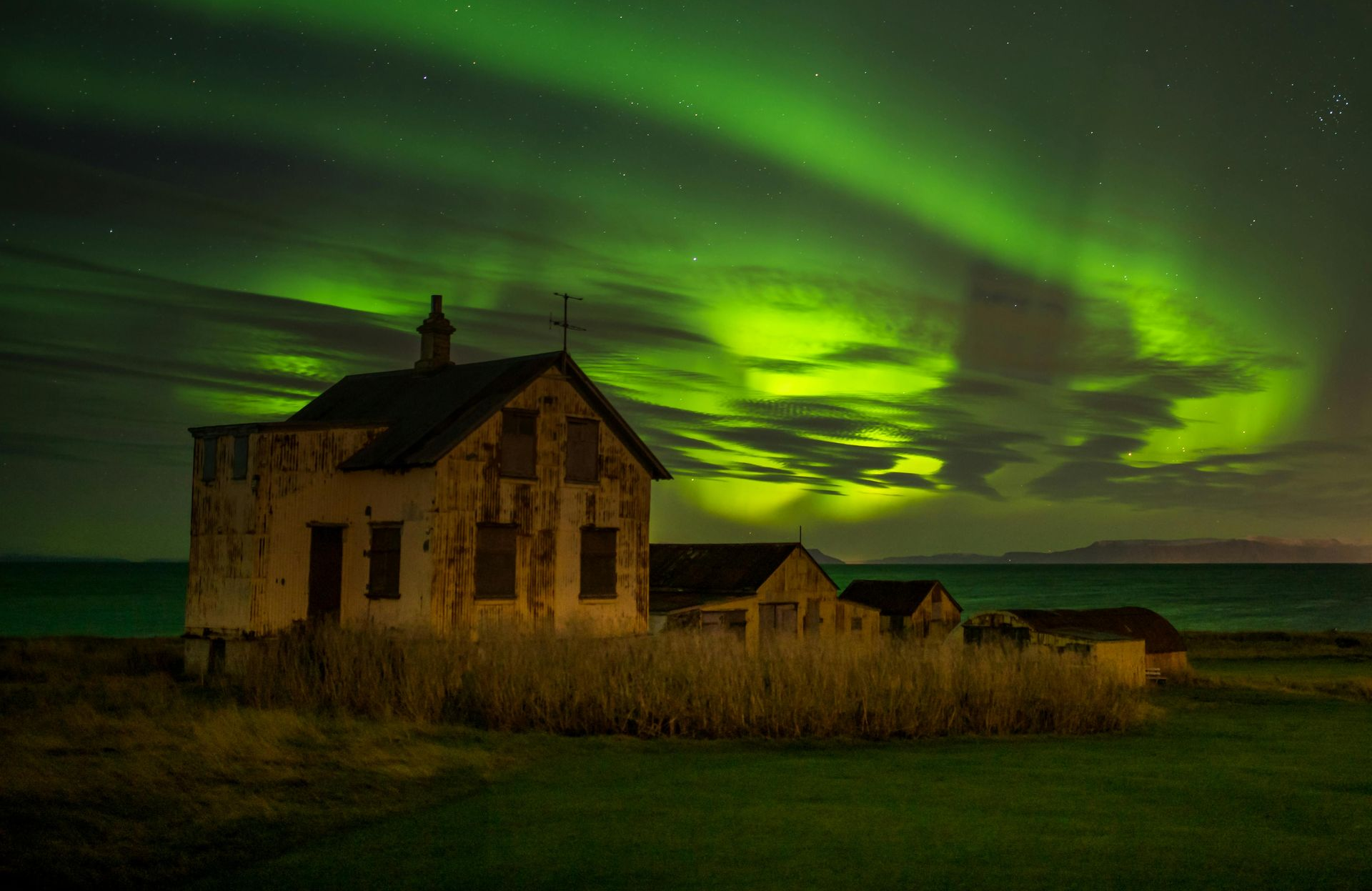 Northern Lights over glacier lagoon in Iceland, winter fantasy escape with icebergs and aurora borealis