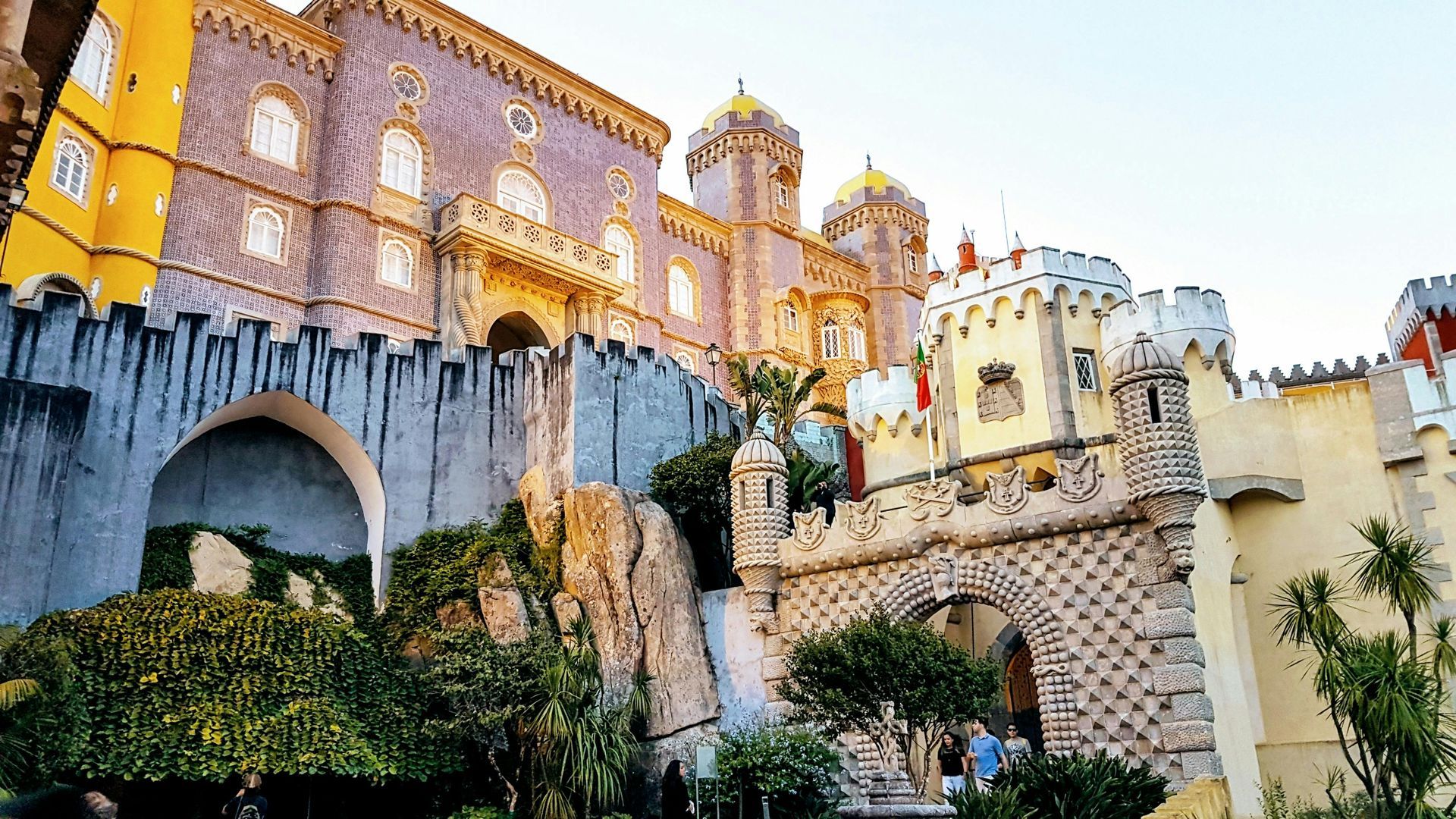 Romantic couple walking through Pena Palace gardens, Portugal