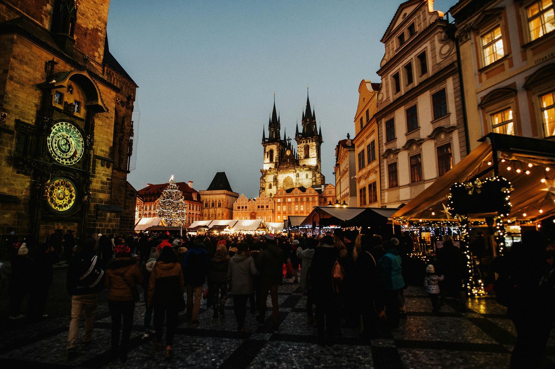 Prague Christmas market in Old Town Square with Gothic spires, fantasy winter travel and cozy winter destination