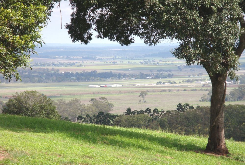 Rolling Green Hillside Overlooking a Vast Valley — All Class Liquid Waste in Clifton, QLD