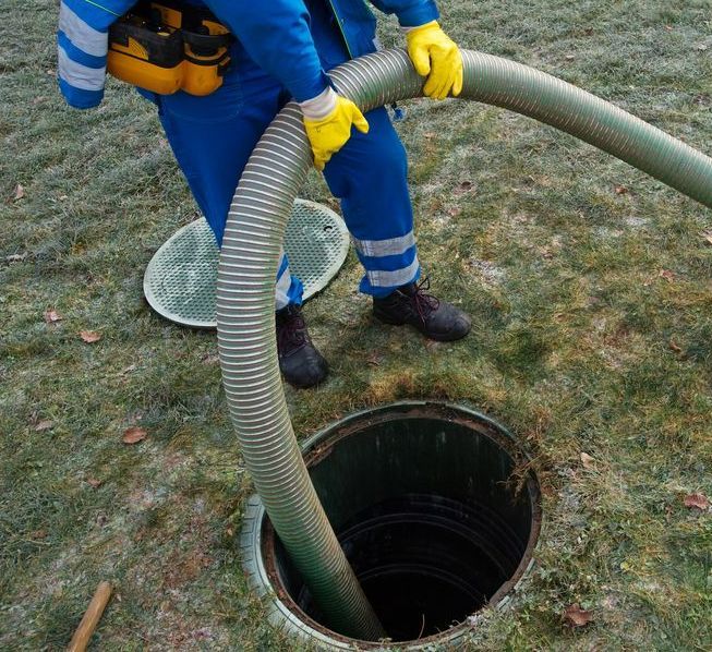 Person is Using a Hose to Pump Out a Septic Tank — All Class Liquid Waste in Clifton, QLD