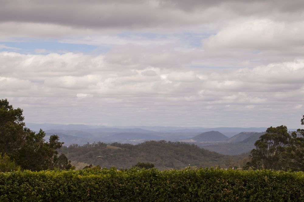 Overlooking a Valley With Rolling Hills Under a Cloudy Sky — All Class Liquid Waste in Highfields, QLD