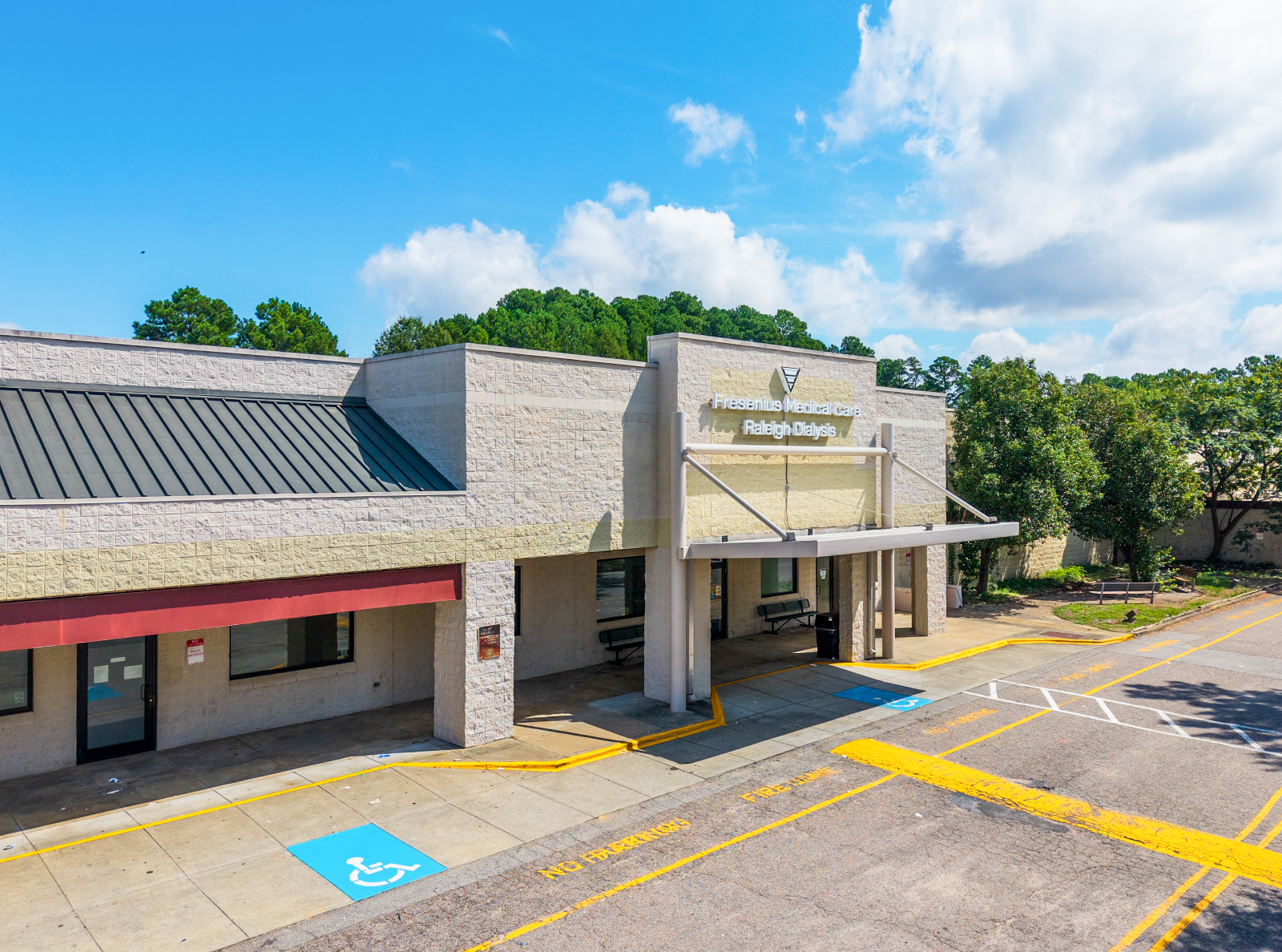 Exterior view of a one-story Fresenius Medical Care dialysis center in Raleigh, NC.