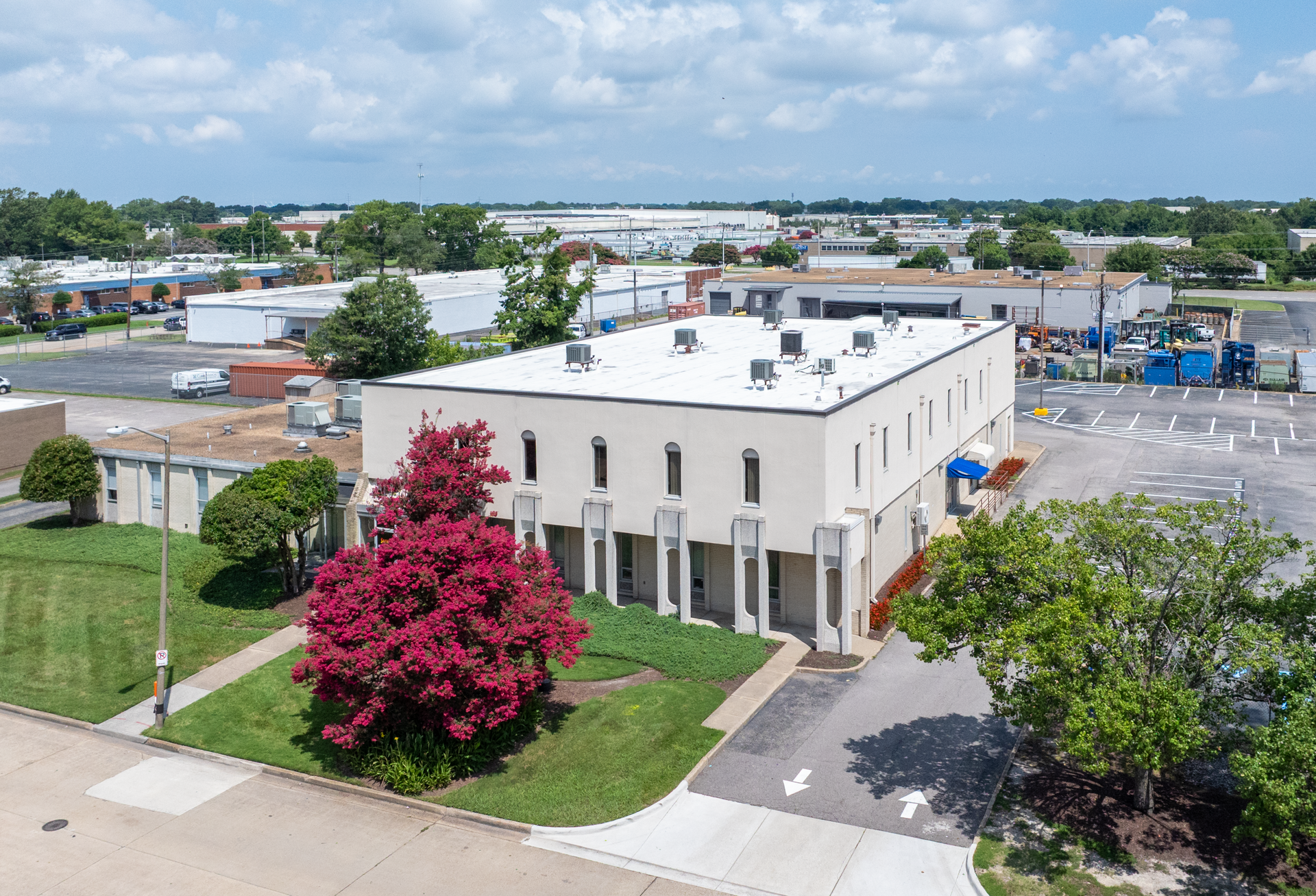 A white building with a blue awning and the word davita on it