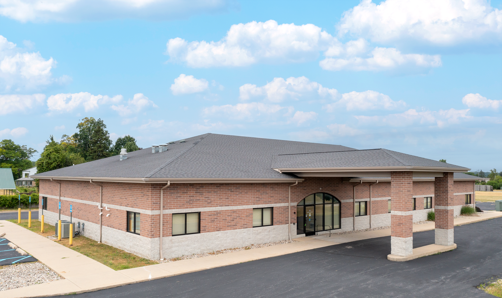 A white building with a blue awning and the word davita on it