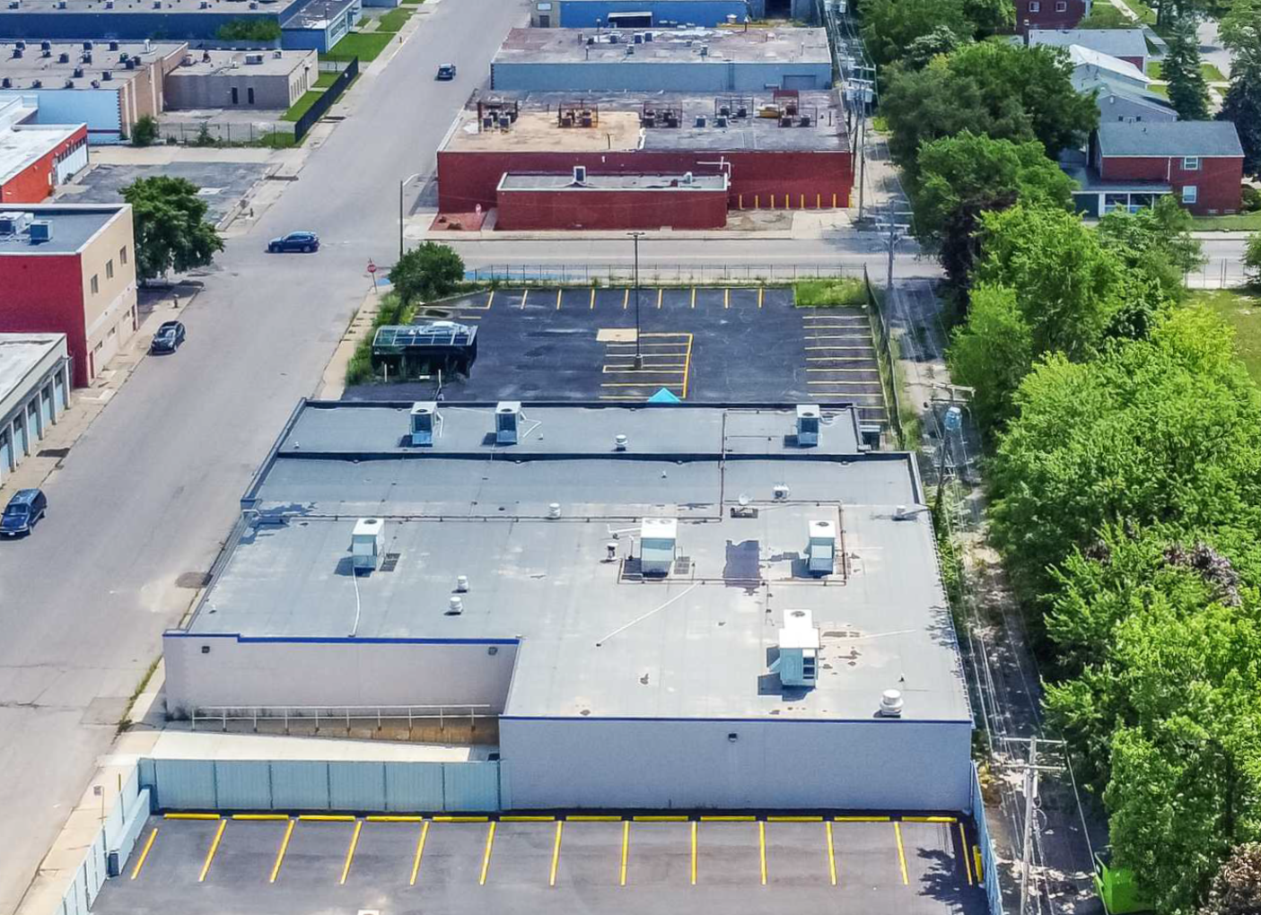 An aerial view of a vivent health building with a parking lot in front of it