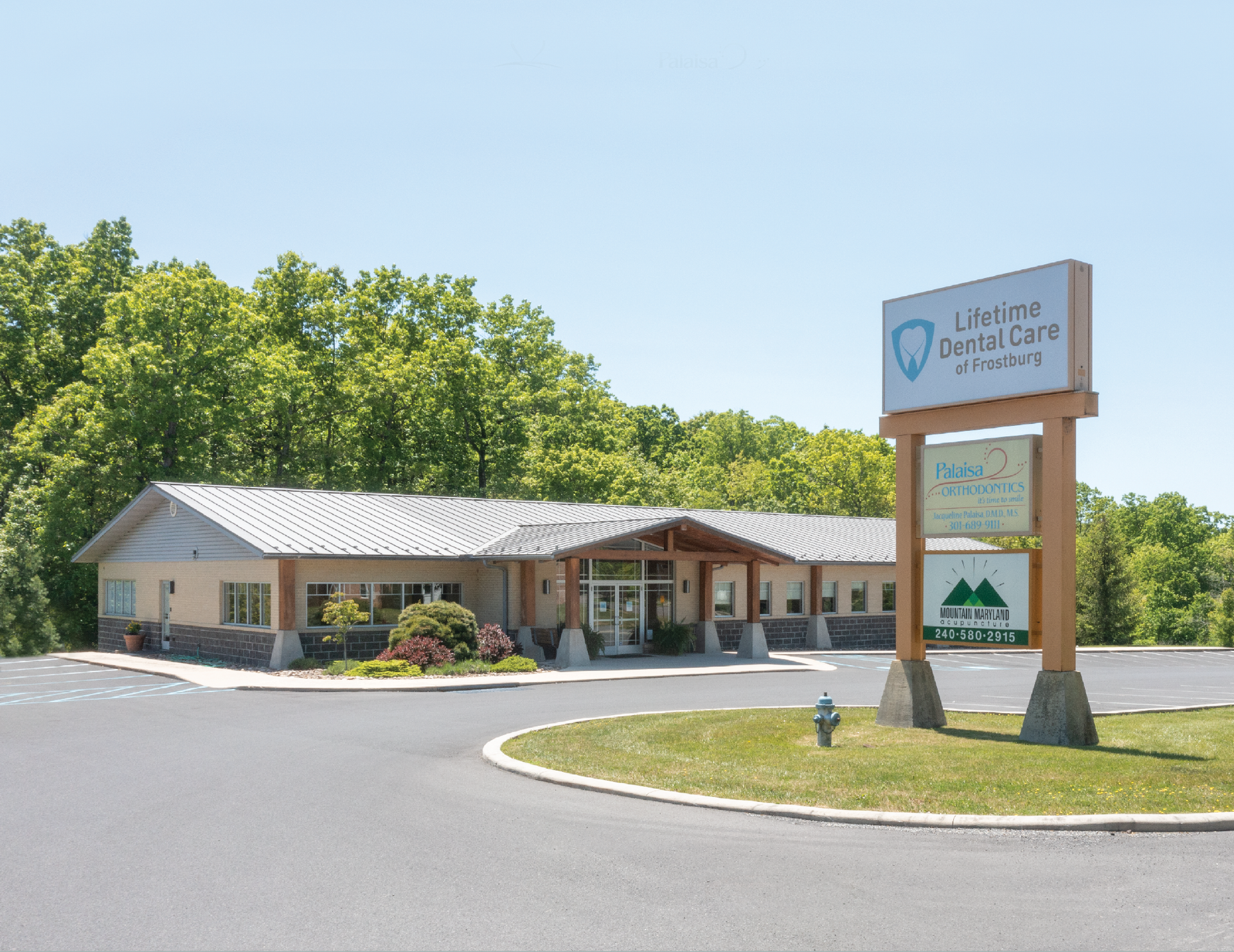 A white building with a blue awning and the word davita on it