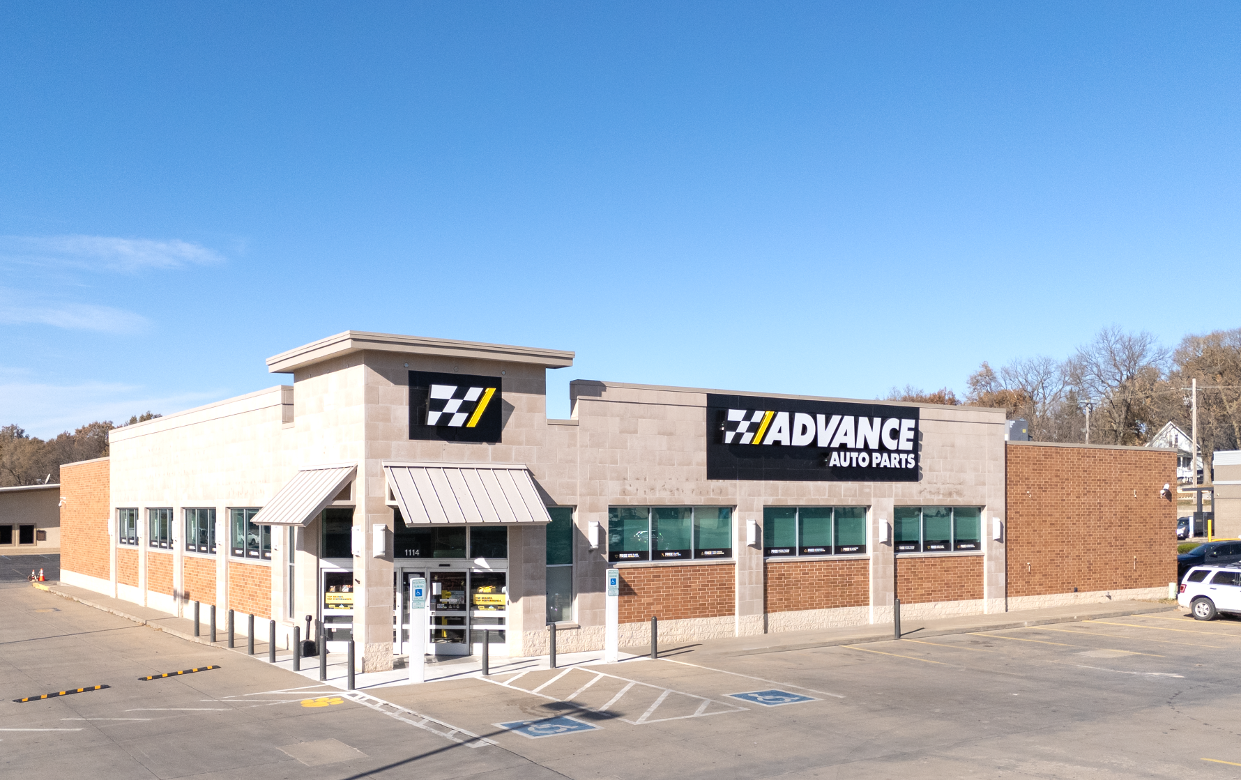 A white building with a blue awning and the word davita on it