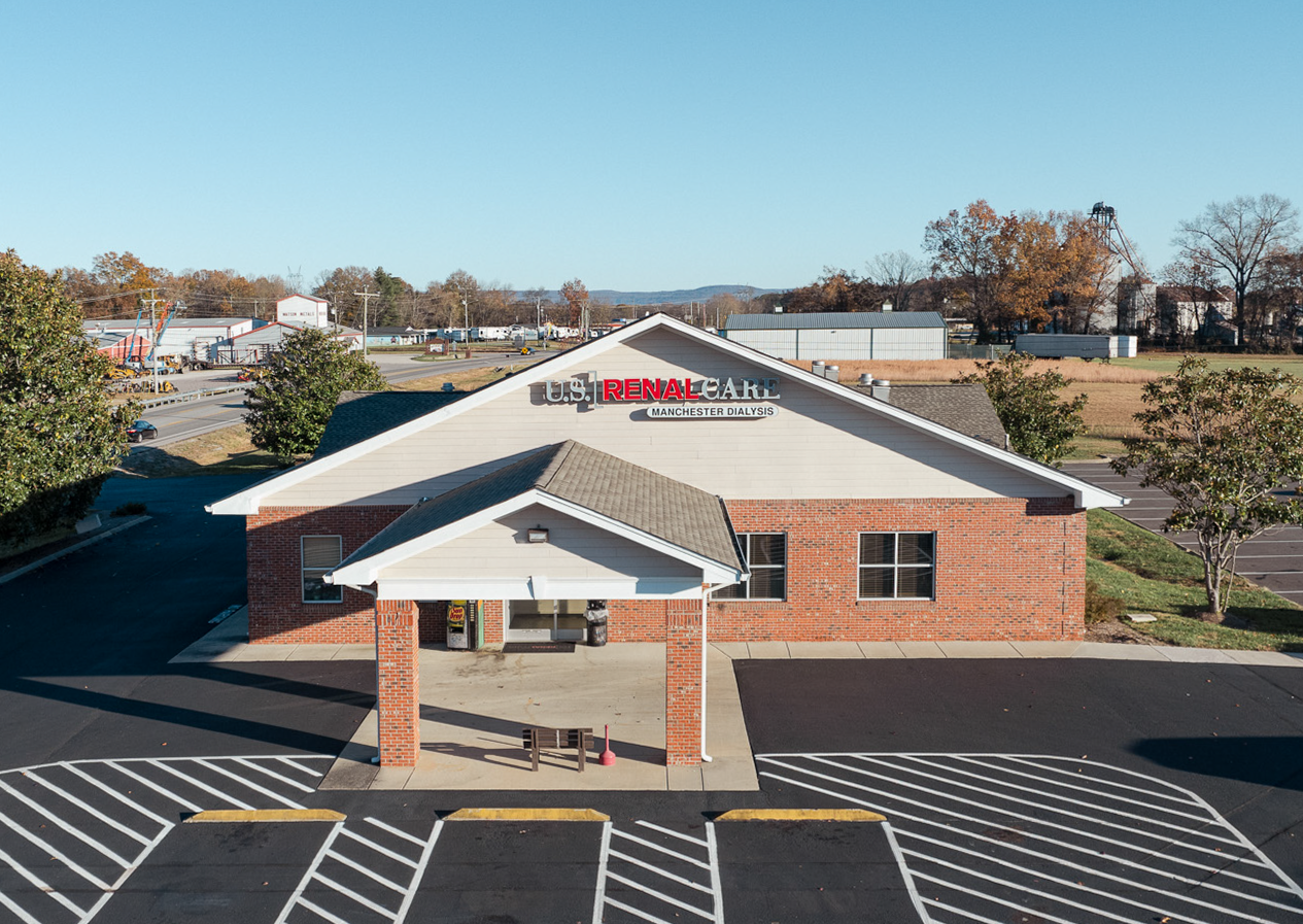 Red brick building with a sign that reads