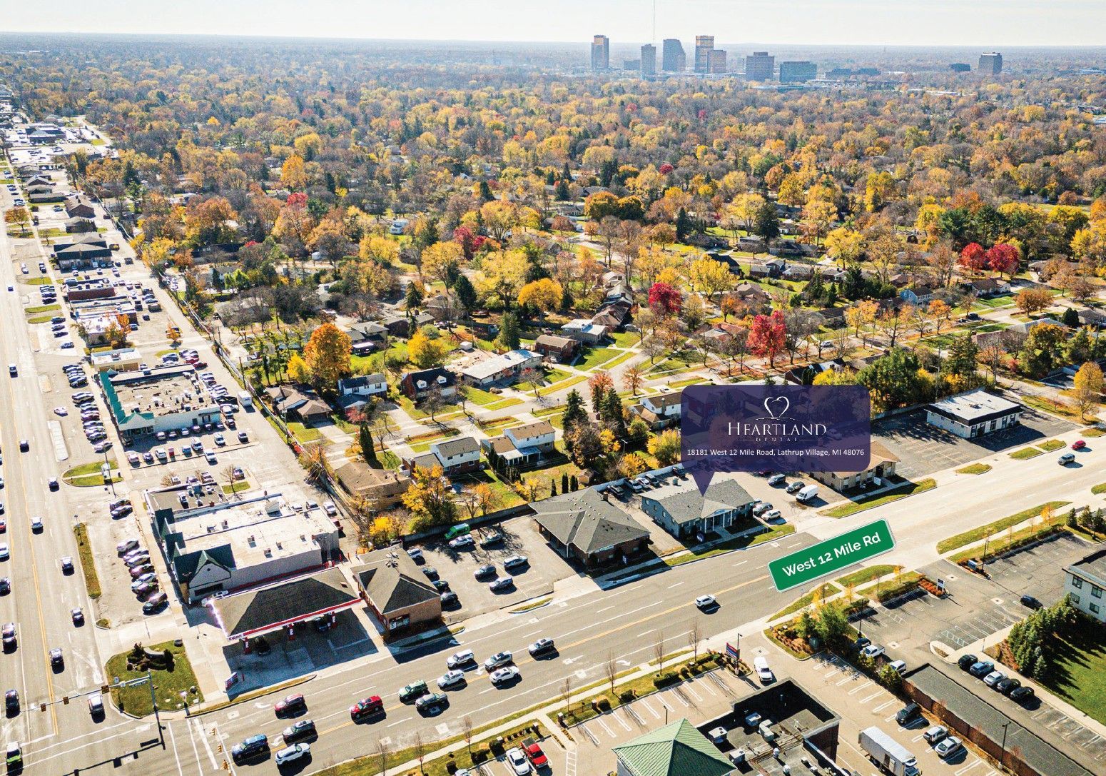 An aerial view of a heartland dental with a city in the background.