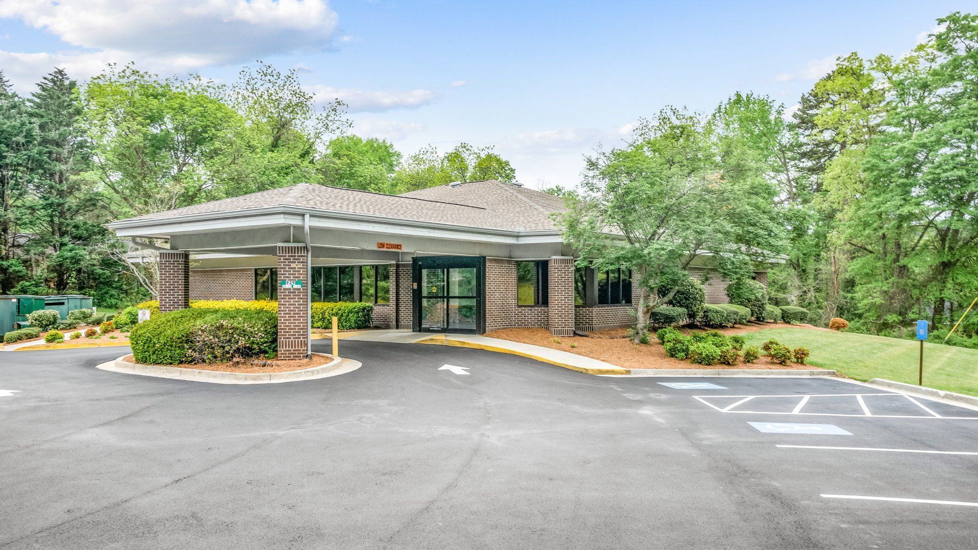 fresenius medical care building with a parking lot in front of it